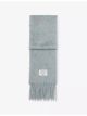 acne-studios-fringed-knitted-scarf-main-1.jpg