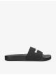 balenciaga-logo-embossed-rubber-slides-main-1.jpg